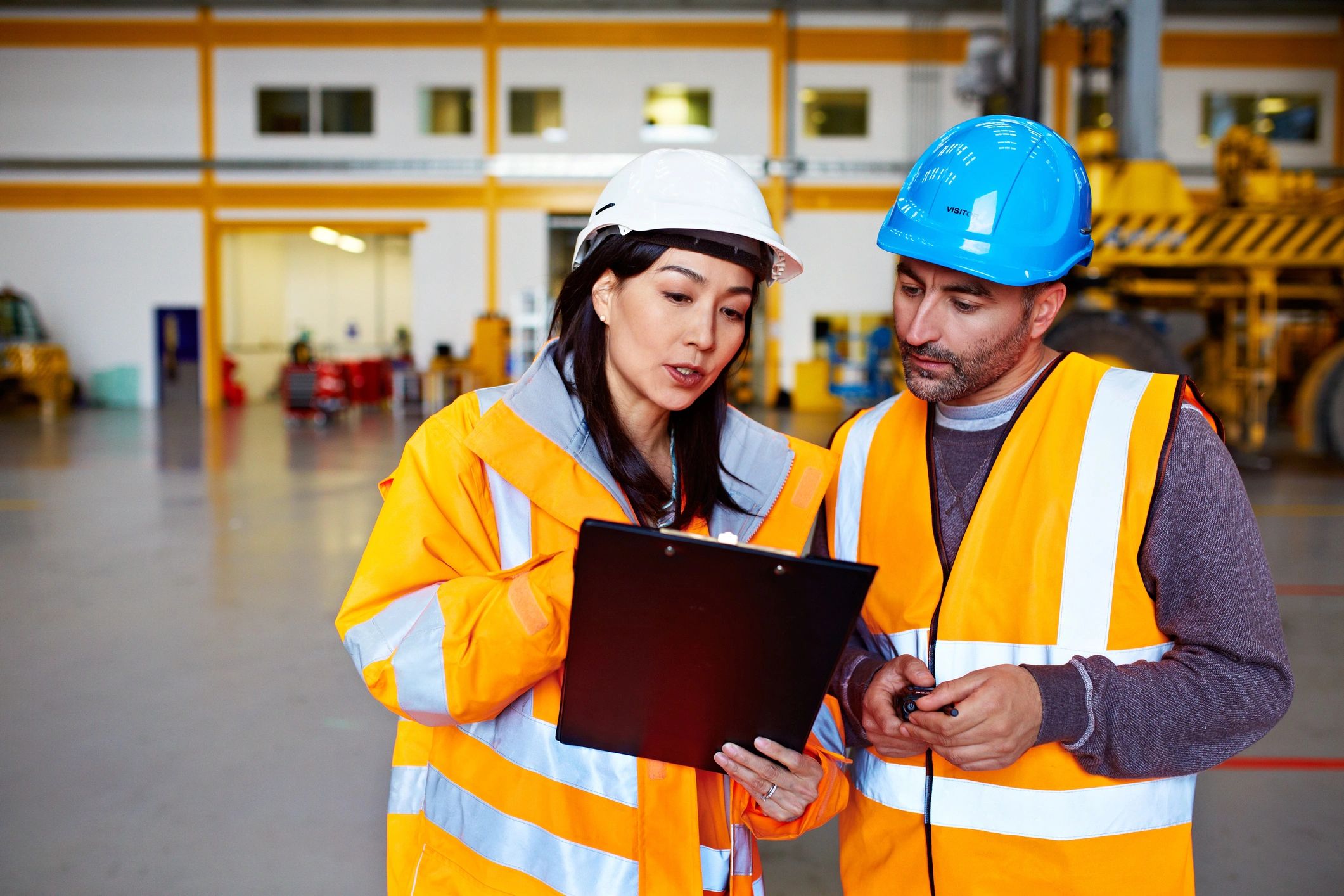 Warehouse team reviewing safety checklist during training